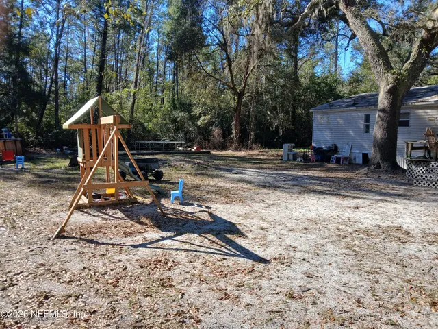 a view of a park with a slide