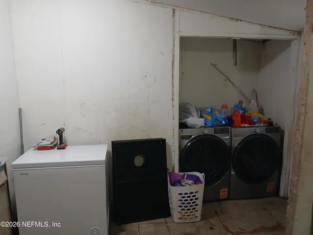 a utility room with dryer and washer