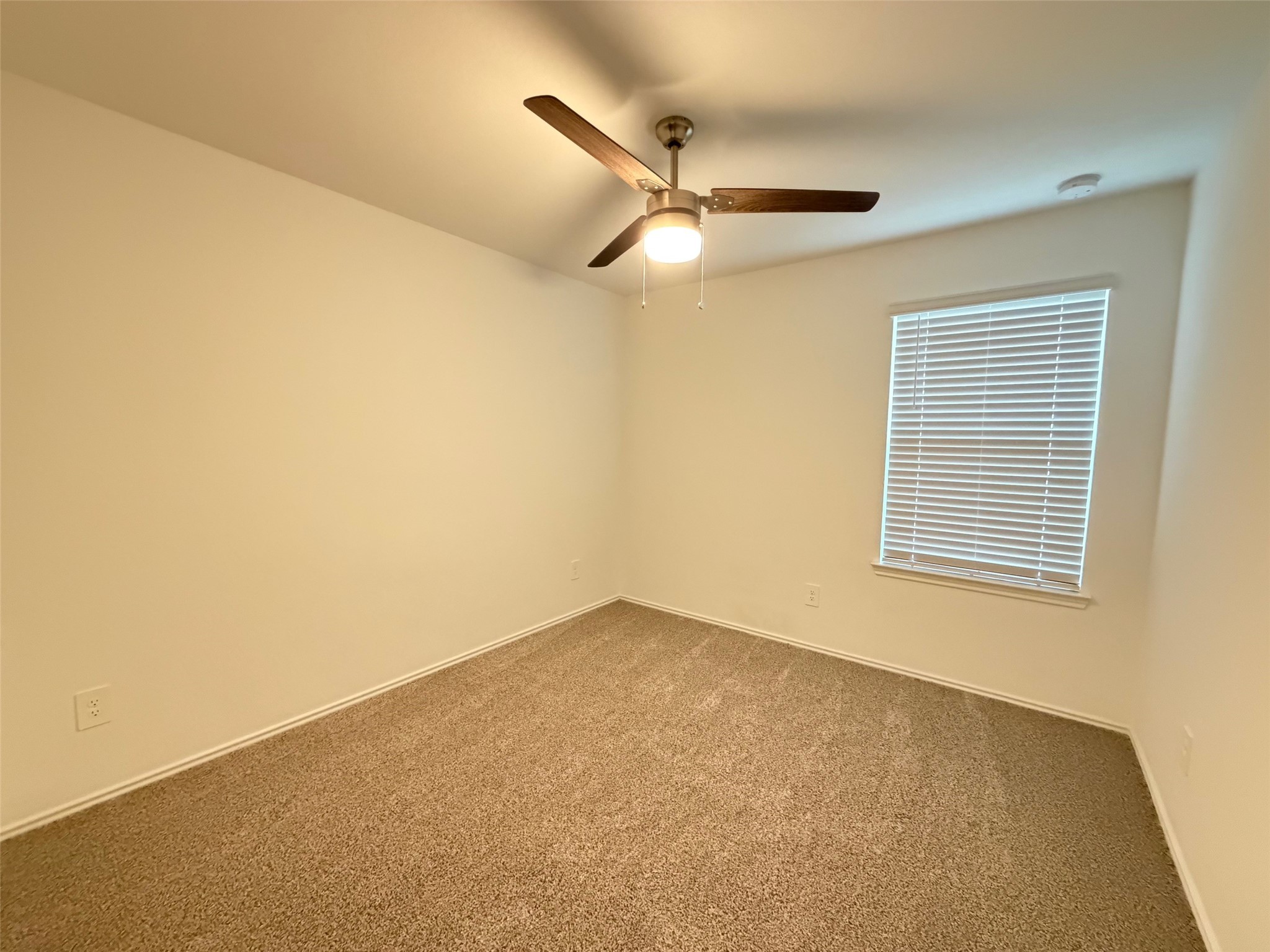 2913 Willow Gulch Way Rosenberg, TX 77469 - Photo 12 of 16 a view of an empty room with a window