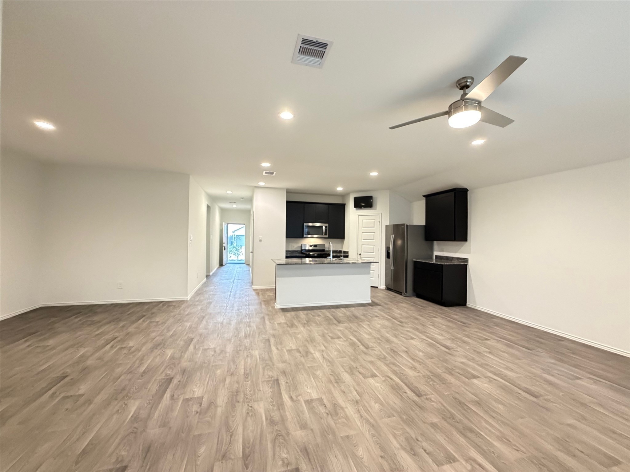 2913 Willow Gulch Way Rosenberg, TX 77469 - Photo 3 of 16 a view of kitchen with microwave and stove
