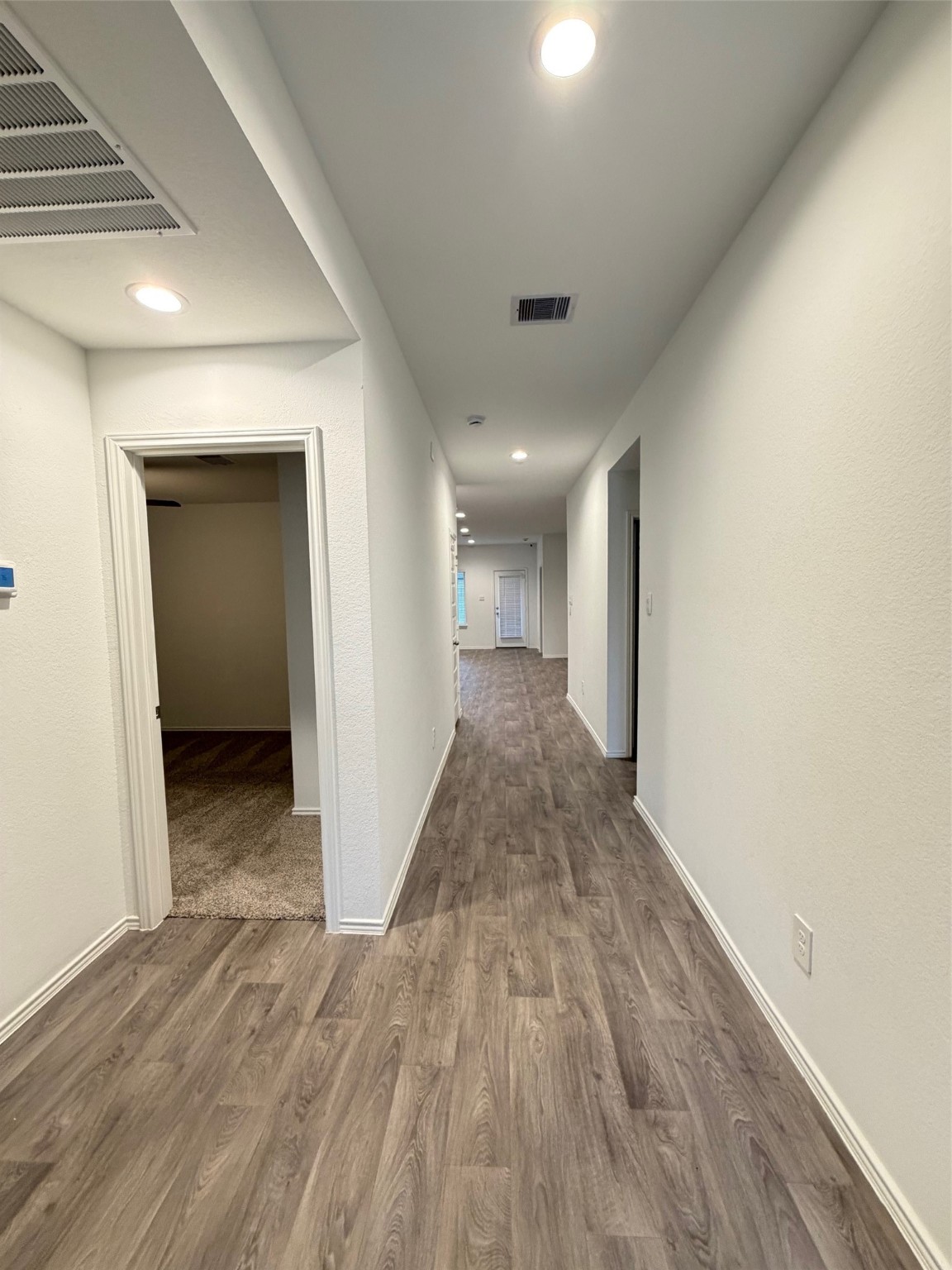 2913 Willow Gulch Way Rosenberg, TX 77469 - Photo 7 of 16 a view of a hallway with wooden floor