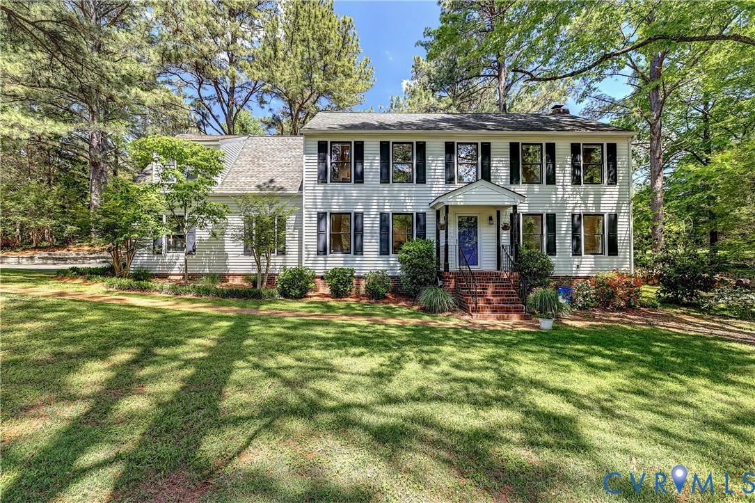 5201 Stone Horse Road Glen Allen, VA 23059 - Photo 1 of 54 a front view of a house with a yard table and chairs