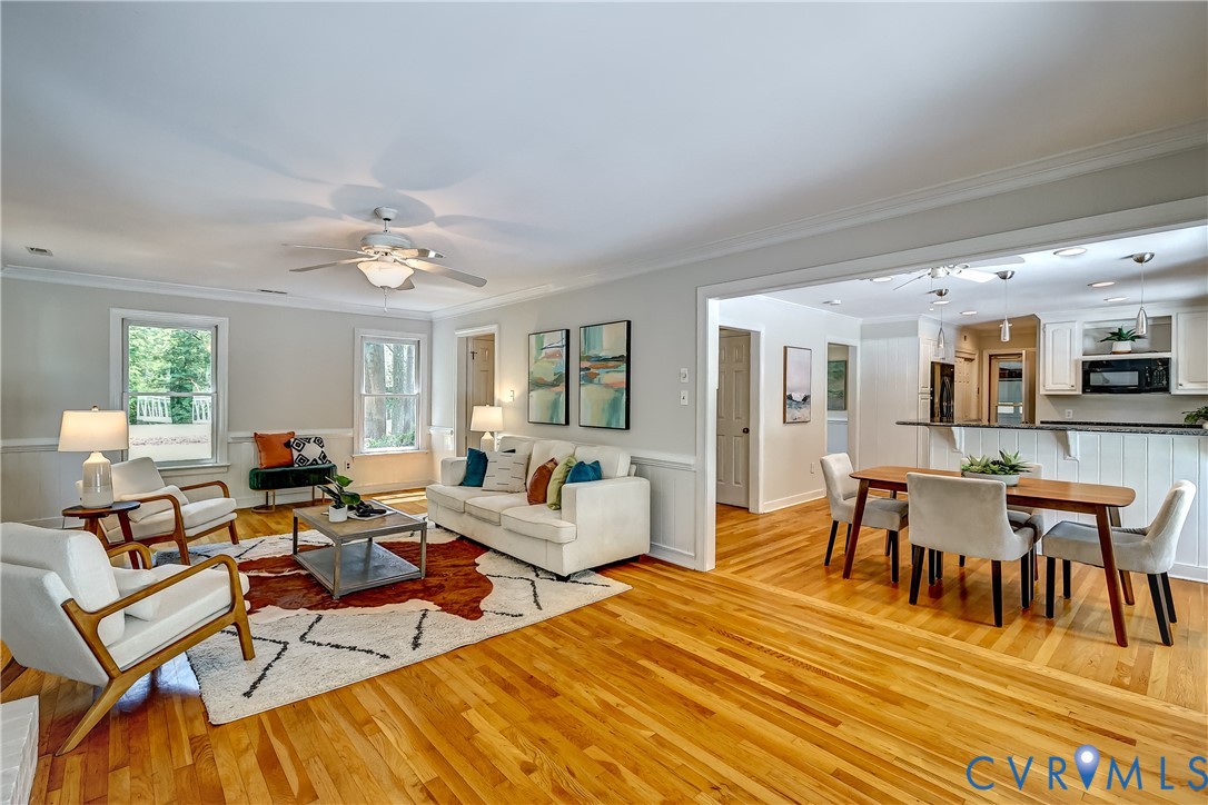 5201 Stone Horse Road Glen Allen, VA 23059 - Photo 11 of 54 a living room with lots of furniture and a chandelier