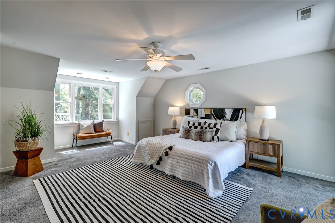 5201 Stone Horse Road Glen Allen, VA 23059 - Photo 29 of 54 a bedroom with bed and a chandelier