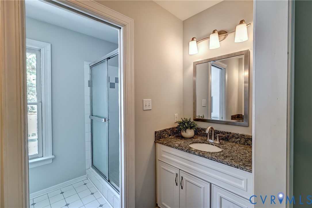 5201 Stone Horse Road Glen Allen, VA 23059 - Photo 32 of 54 a bathroom with a granite countertop sink and a mirror