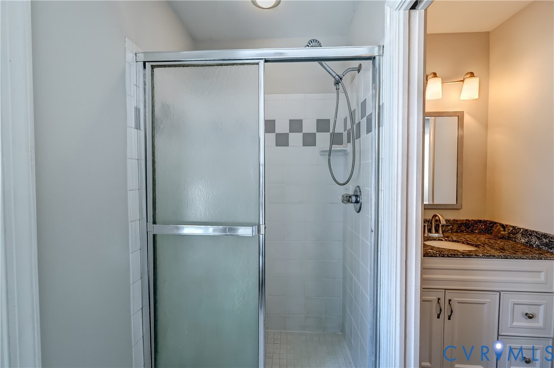 5201 Stone Horse Road Glen Allen, VA 23059 - Photo 33 of 54 a bathroom with a glass shower door