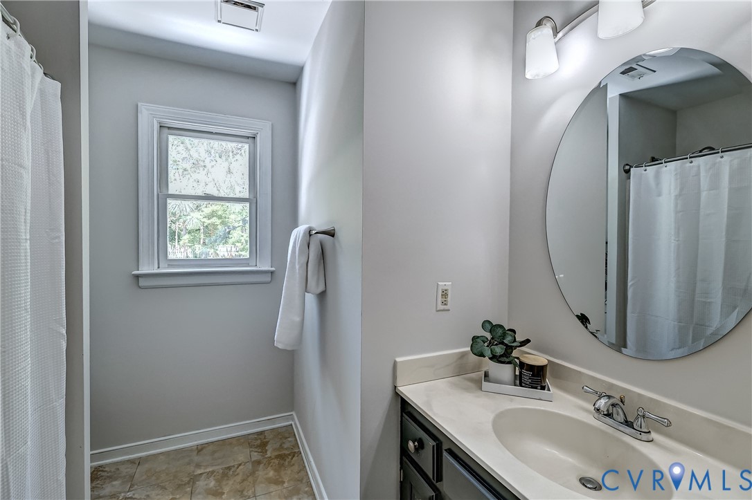 5201 Stone Horse Road Glen Allen, VA 23059 - Photo 38 of 54 a bathroom with a sink vanity and a mirror