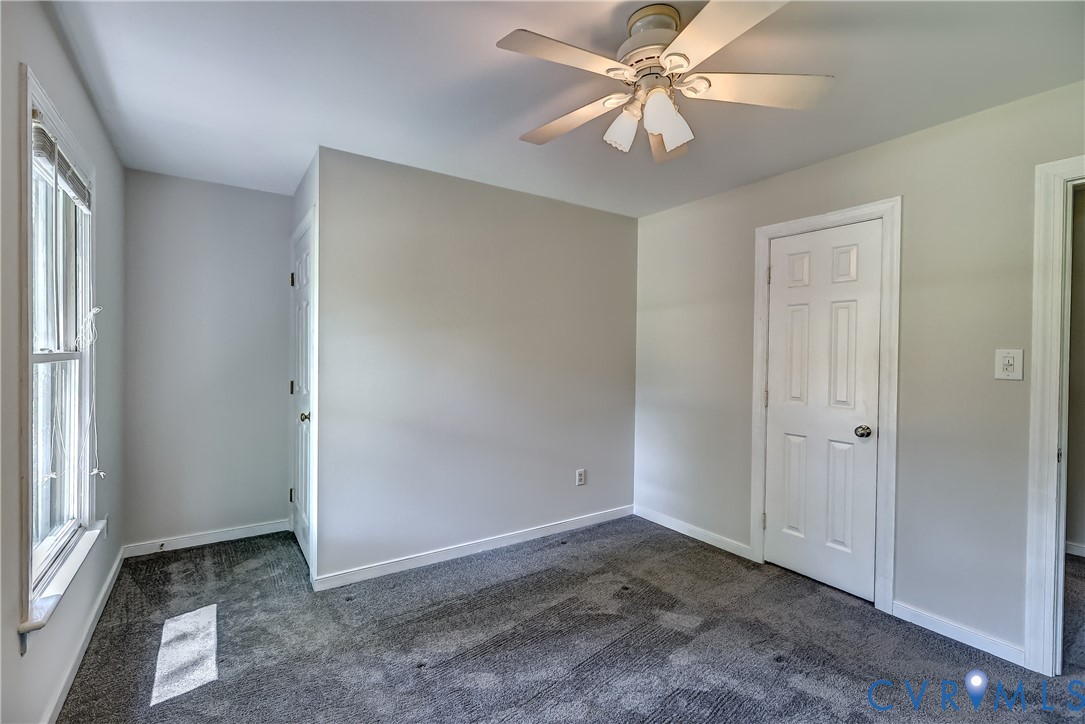 5201 Stone Horse Road Glen Allen, VA 23059 - Photo 40 of 54 wooden floor in an empty room with a window