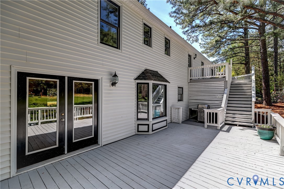 5201 Stone Horse Road Glen Allen, VA 23059 - Photo 42 of 54 a view of a house with a barbeque and wooden floor and fence next to a yard