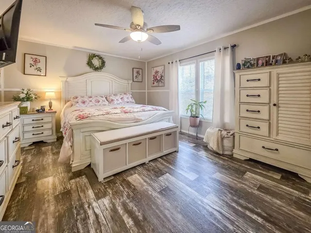 a bedroom with a bed and a table