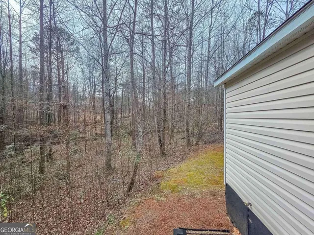 a view of a backyard of the house