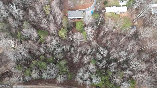 an aerial view of residential house with outdoor space and parking