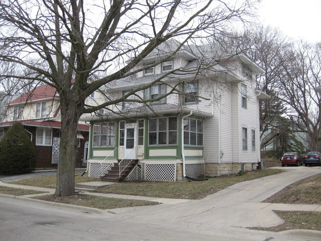 136 John Street DeKalb, IL 60115 - Photo 1 of 25 a view of a house with a yard and large tree