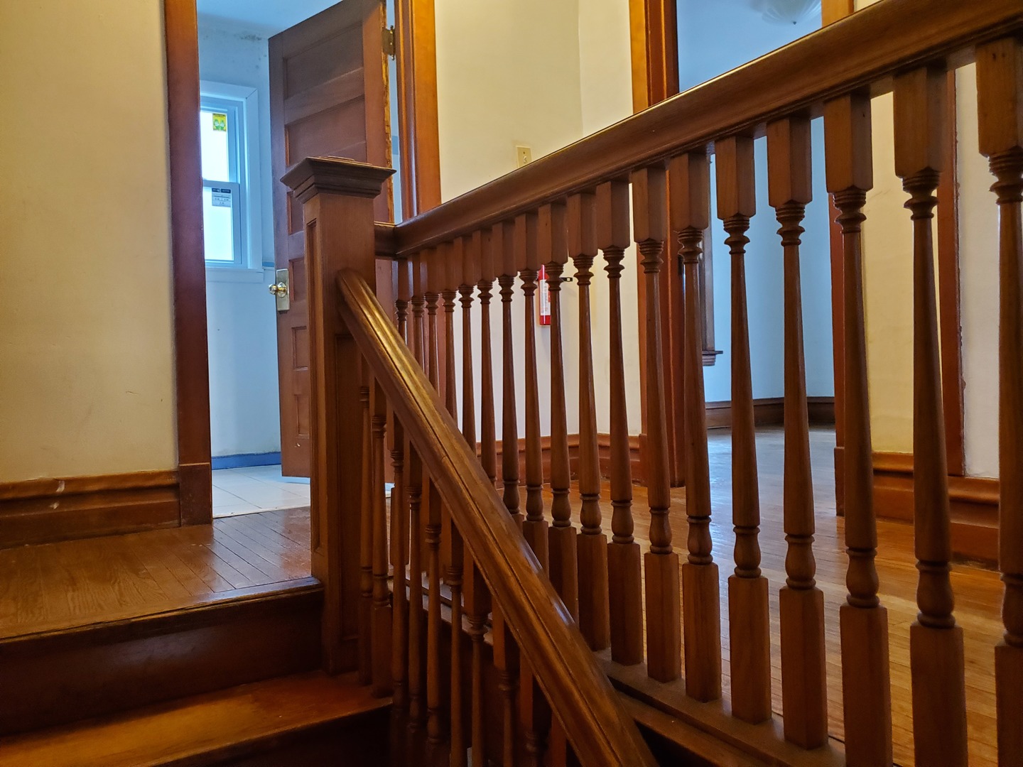 136 John Street DeKalb, IL 60115 - Photo 11 of 25 a view of a balcony with wooden floor