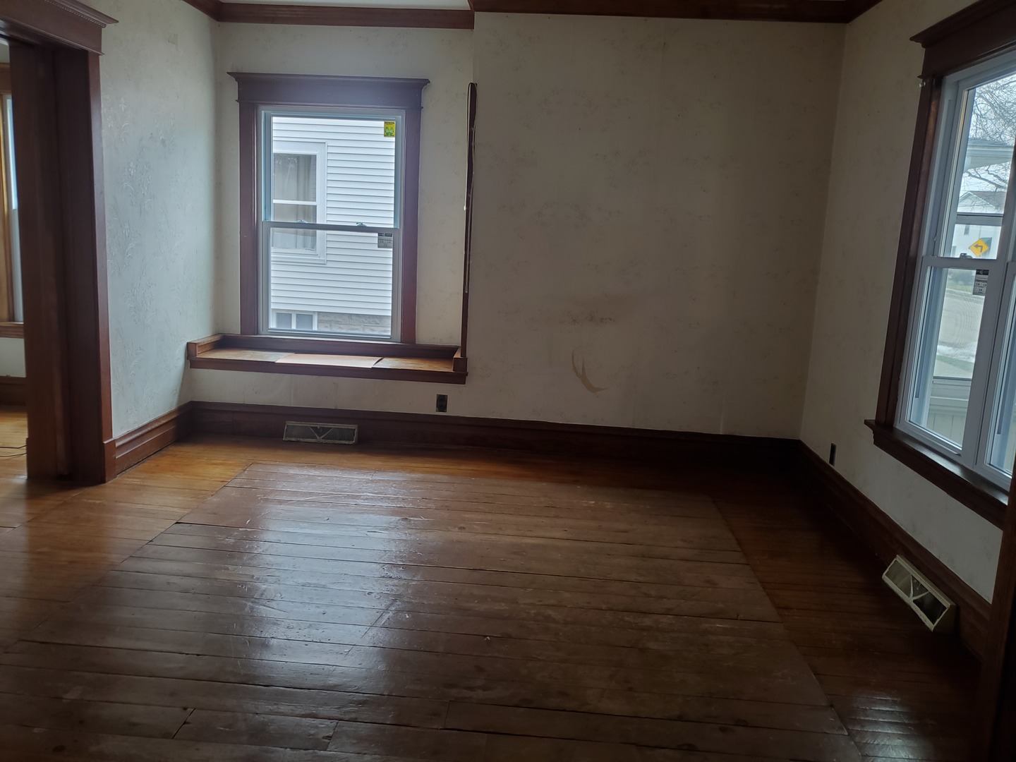136 John Street DeKalb, IL 60115 - Photo 12 of 25 a view of room with window and wooden floor