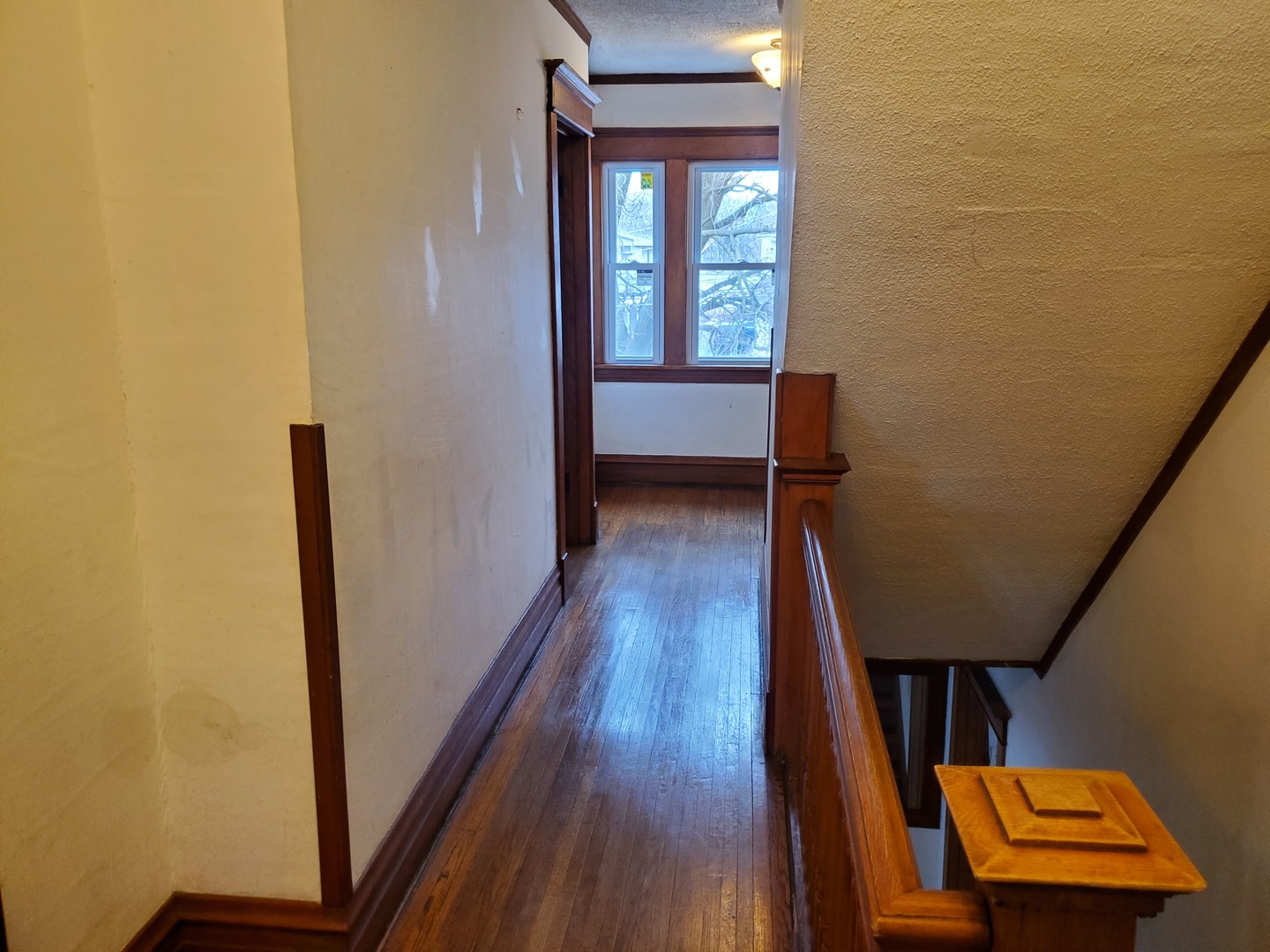 136 John Street DeKalb, IL 60115 - Photo 15 of 25 a view of a hallway with wooden floor and glass door