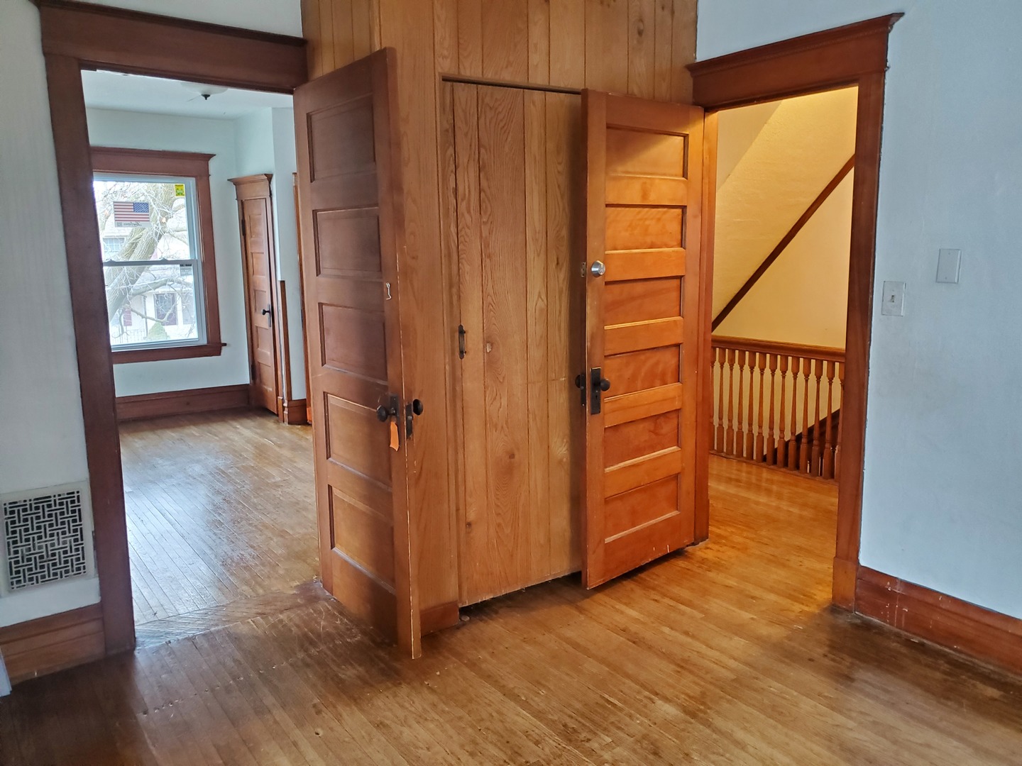 136 John Street DeKalb, IL 60115 - Photo 16 of 25 a view of an empty room with wooden floor and a window