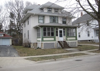 136 John Street DeKalb, IL 60115 - Photo 2 of 25 a front view of a house with a yard