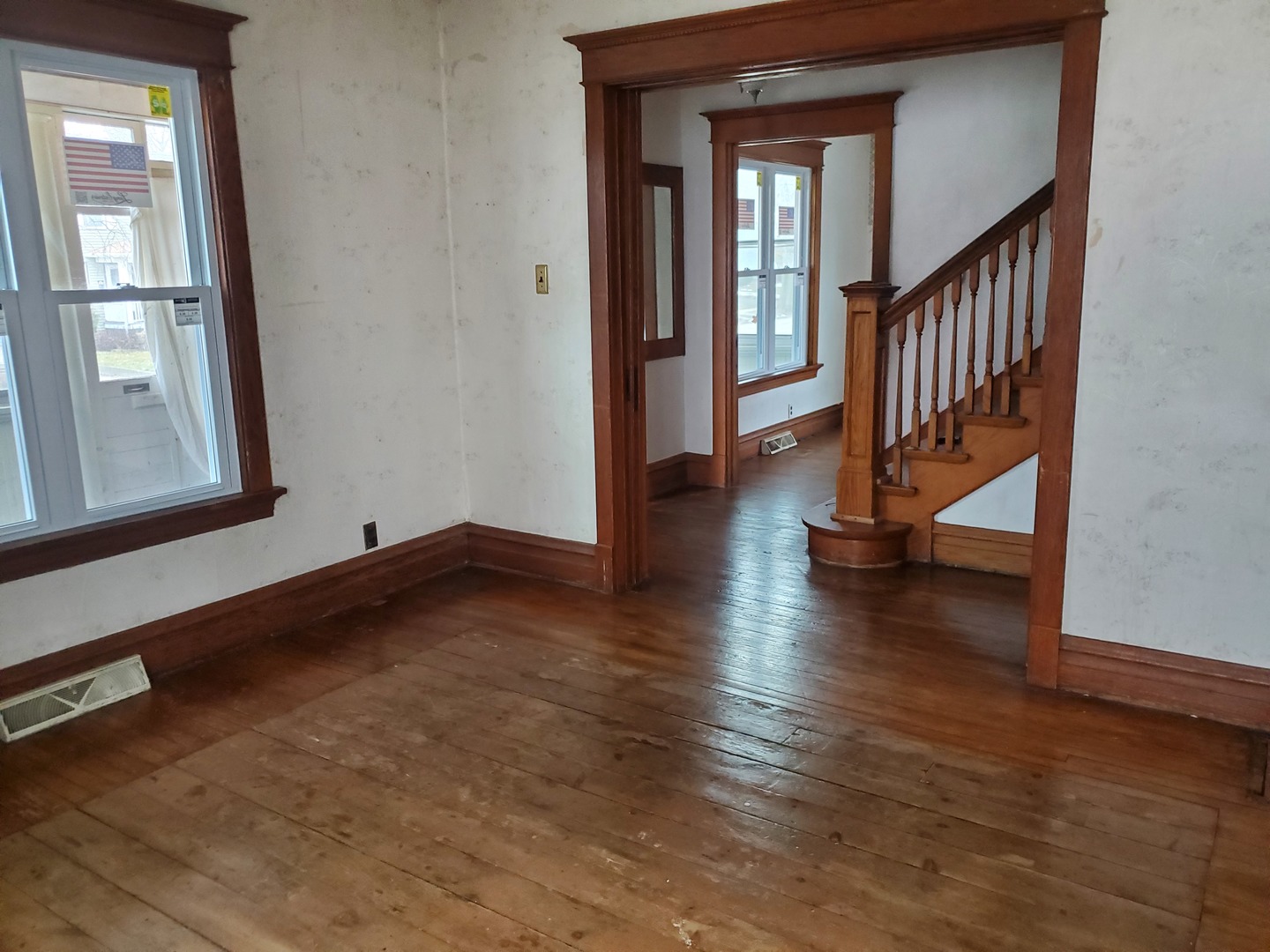 136 John Street DeKalb, IL 60115 - Photo 10 of 25 a view of an entryway with wooden floor and door