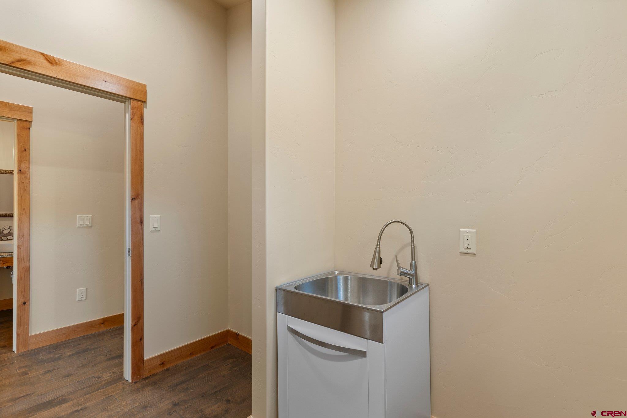 283 Edgemont Meadows Road Durango, CO 81301 - Photo 22 of 34 a room with a sink and washing machine