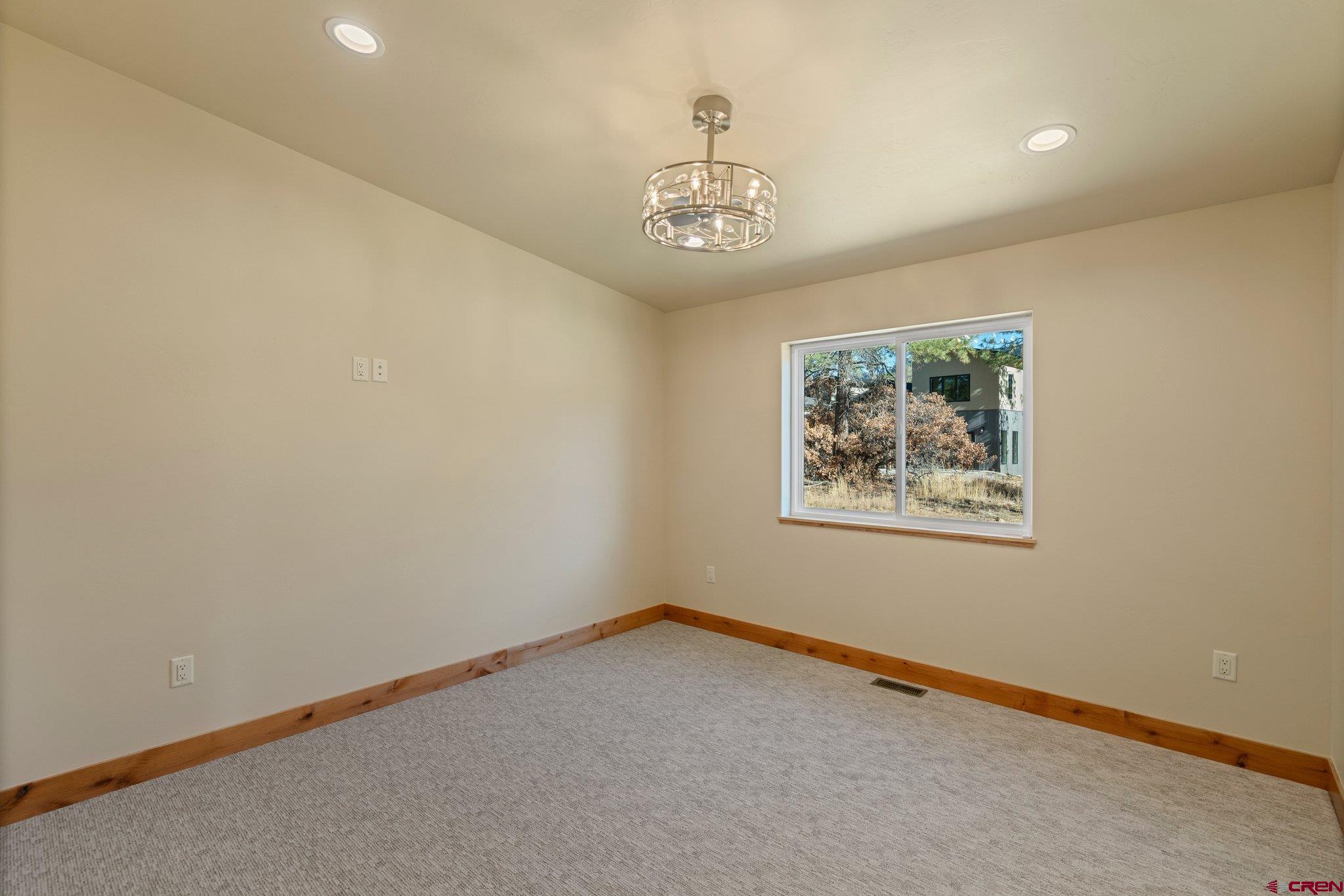 283 Edgemont Meadows Road Durango, CO 81301 - Photo 27 of 34 en empty room with windows