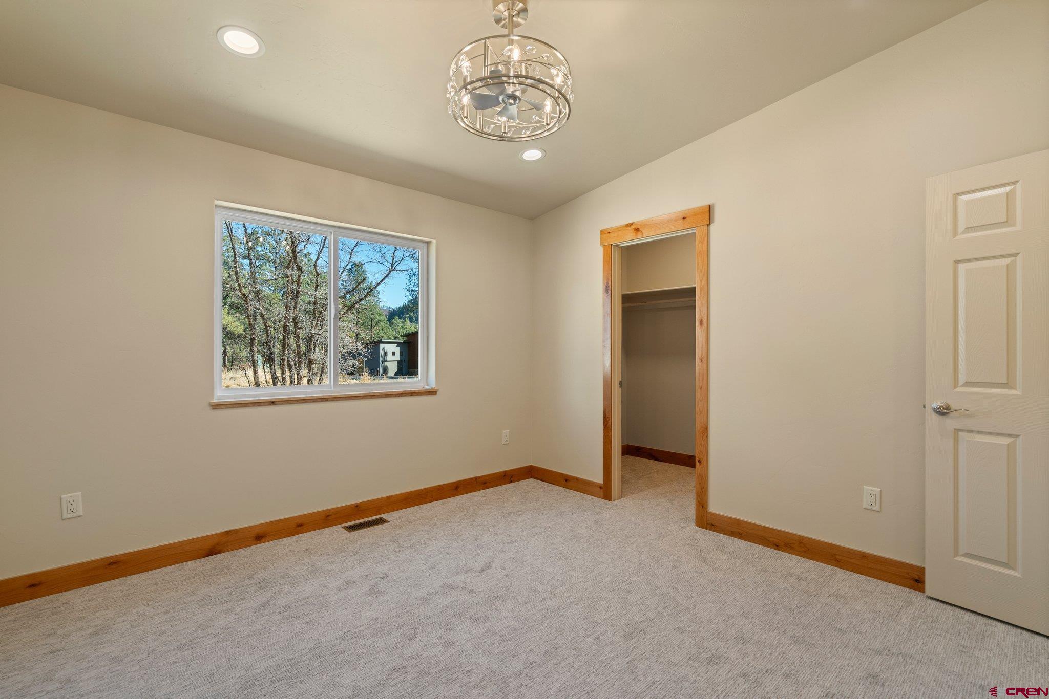 283 Edgemont Meadows Road Durango, CO 81301 - Photo 28 of 34 a view of an empty room with a window