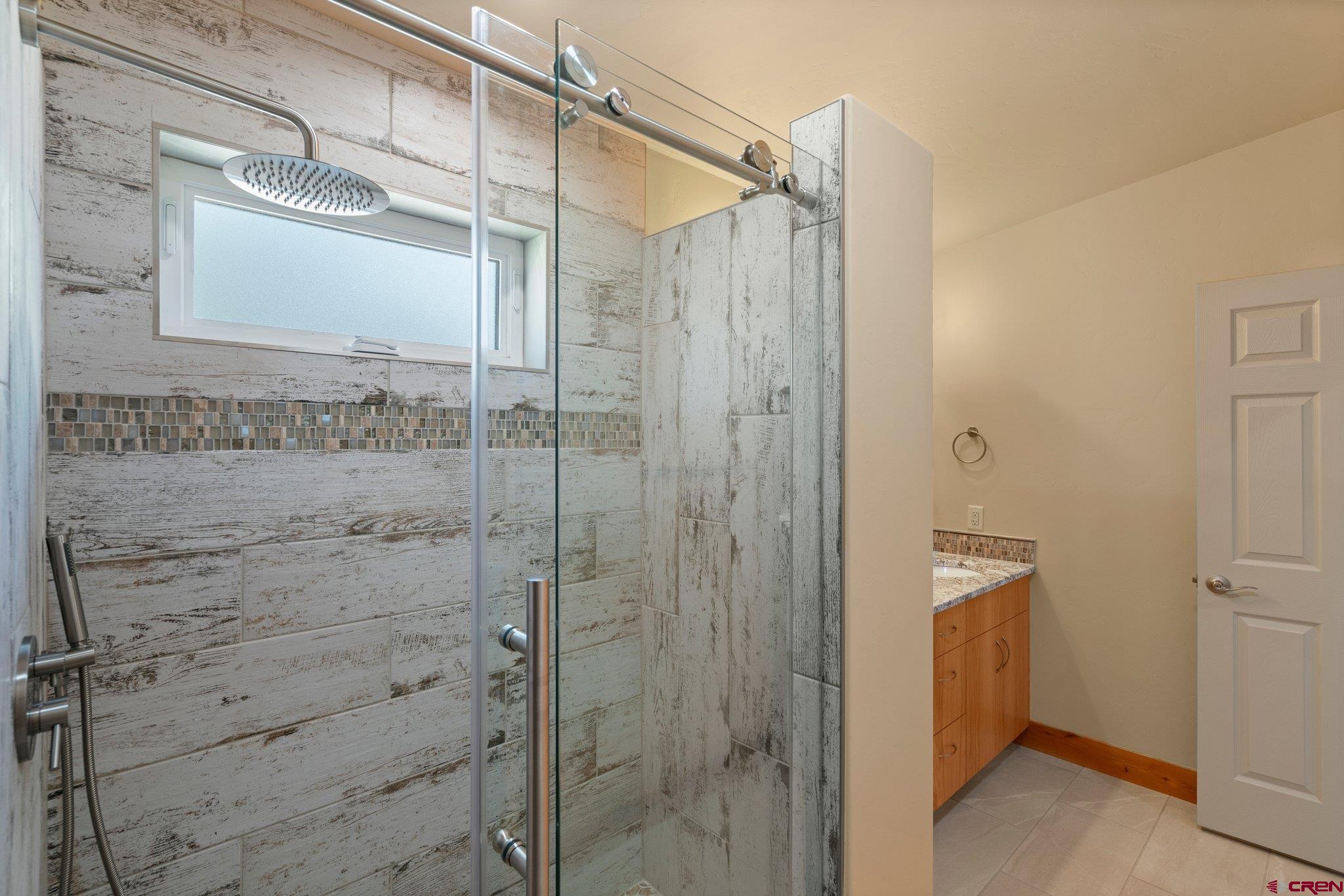 283 Edgemont Meadows Road Durango, CO 81301 - Photo 33 of 34 a bathroom with a shower and a sink
