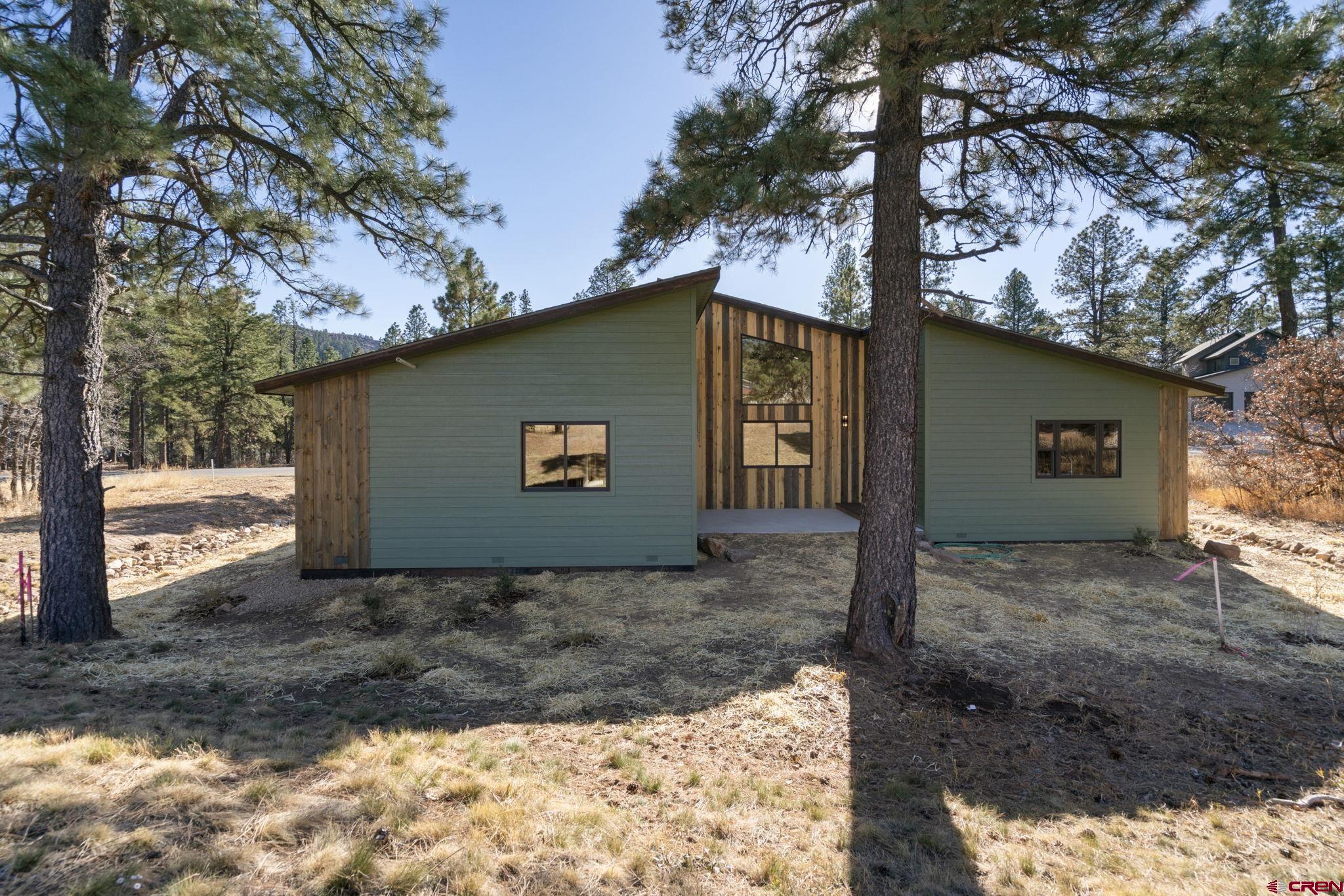 283 Edgemont Meadows Road Durango, CO 81301 - Photo 4 of 34 a view of a house with a yard