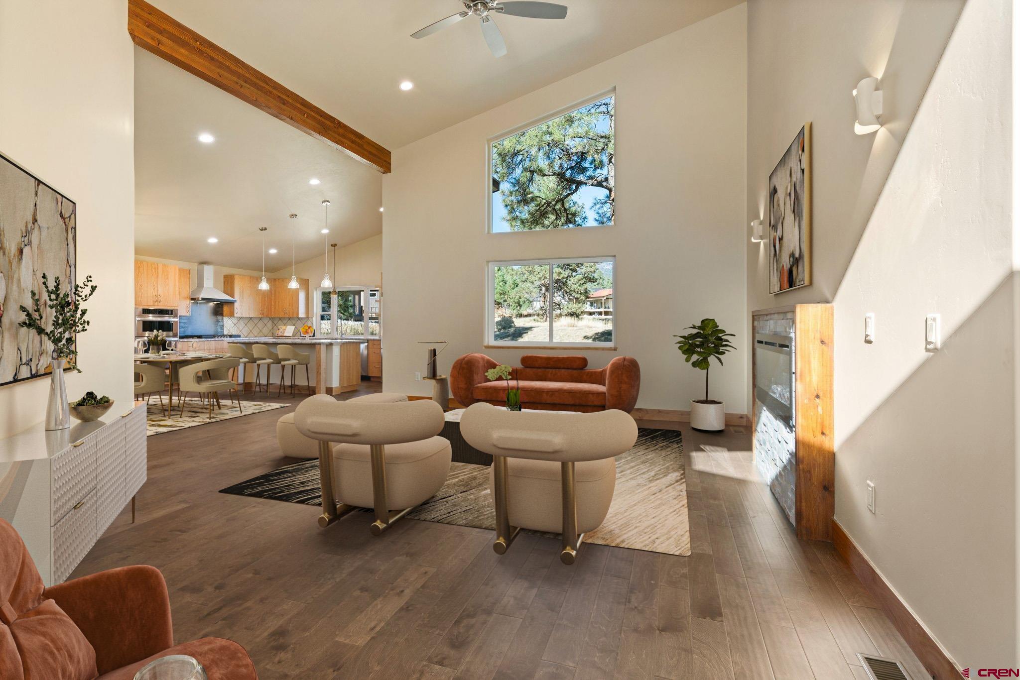283 Edgemont Meadows Road Durango, CO 81301 - Photo 8 of 34 a living room with furniture and a large window