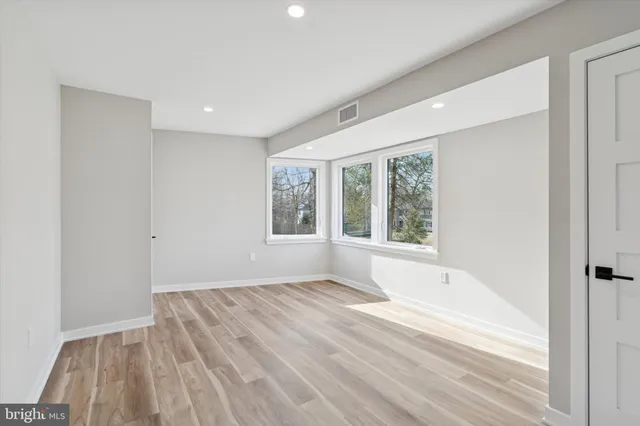 a view of room with window and hardwood floor