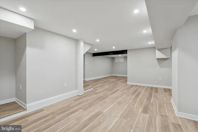 a view of a room with wooden floor