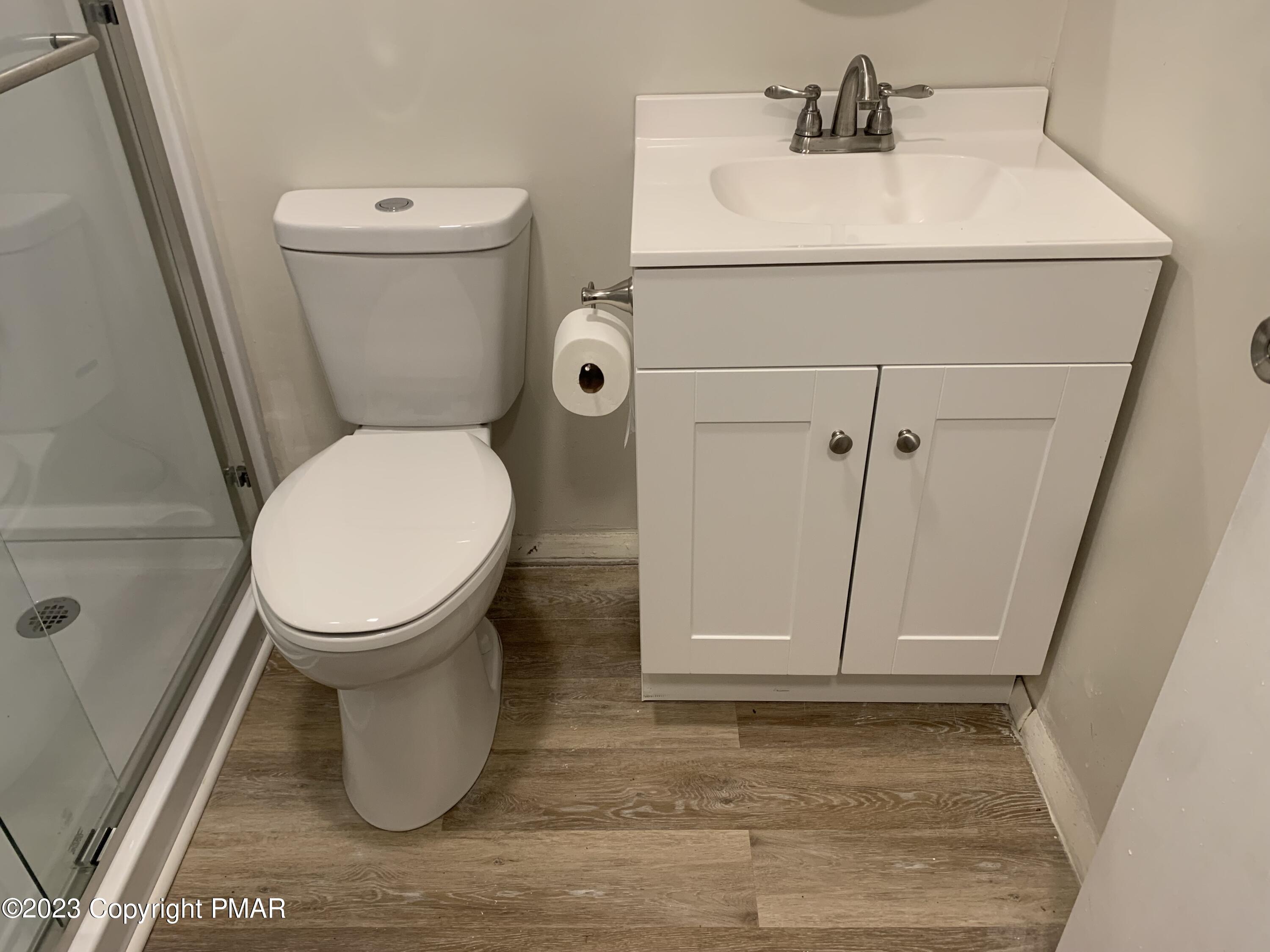 130 View Court, Unit 103 Mount Pocono, PA 18344 - Photo 4 of 11 a bathroom with a sink and a toilet
