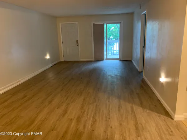 a view of livingroom with wooden floor