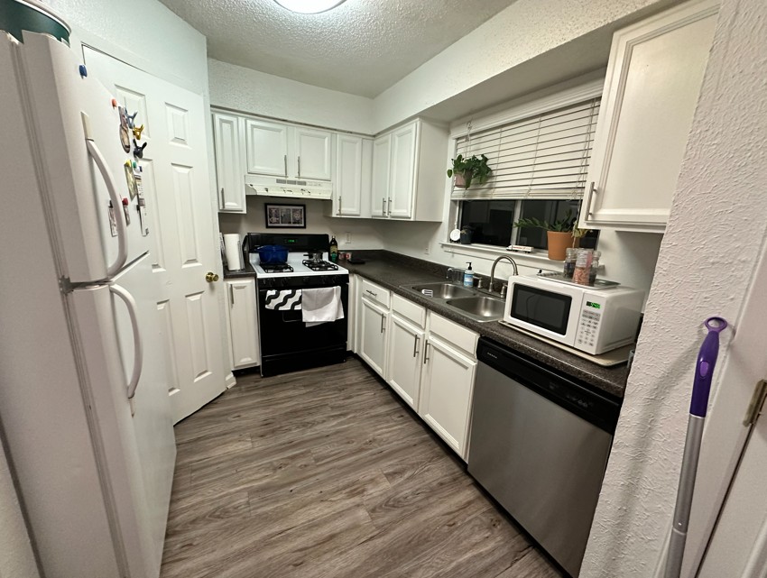 2005 Glen Allen Street, Unit 110 Austin, TX 78704 - Photo 6 of 13 a kitchen with stainless steel appliances a refrigerator a stove a sink and a refrigerator