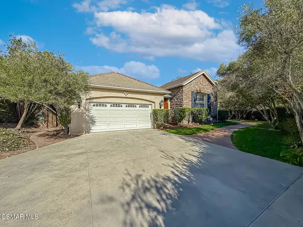 a open kitchen with stainless steel appliances granite countertop a stove and a refrigerator
