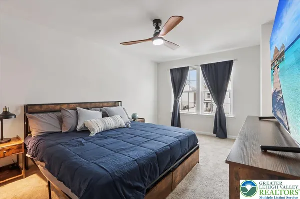 a bedroom with a bed and a balcony