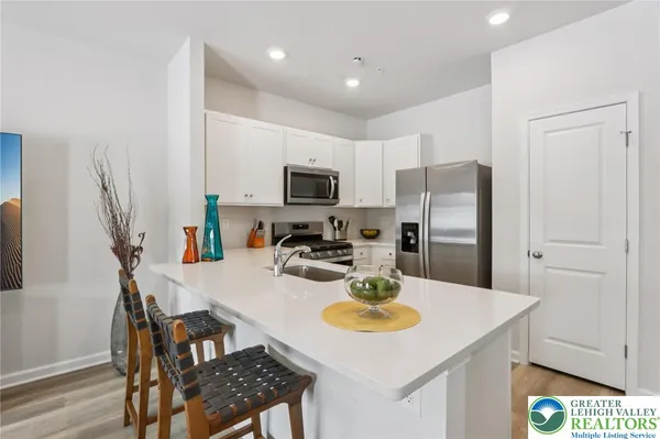 a kitchen with a dining table and chairs