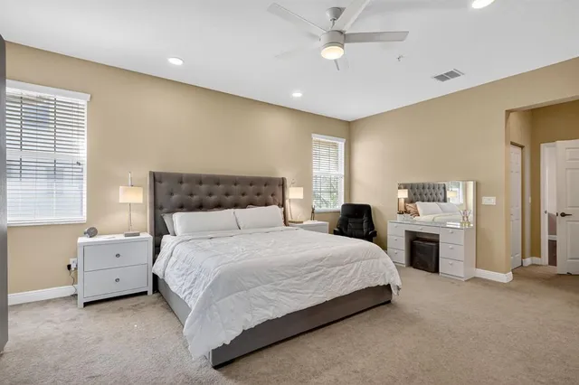 a bedroom with bed and window