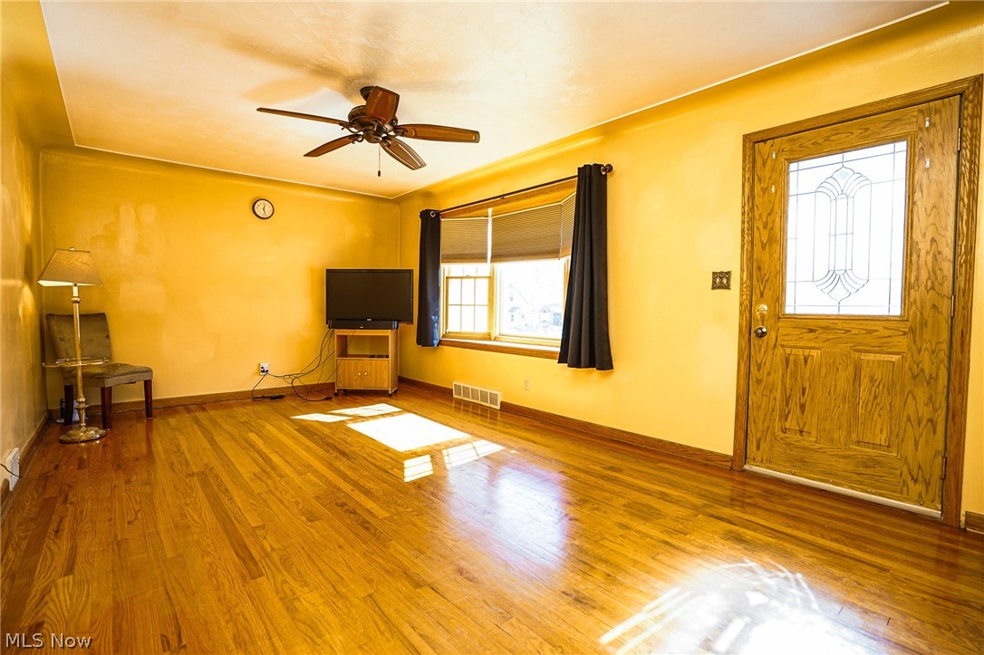453 Omar Street Struthers, OH 44471 - Photo 10 of 27 Entryway with wood-type flooring and ceiling fan