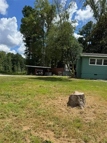 a view of outdoor space with garden and trees