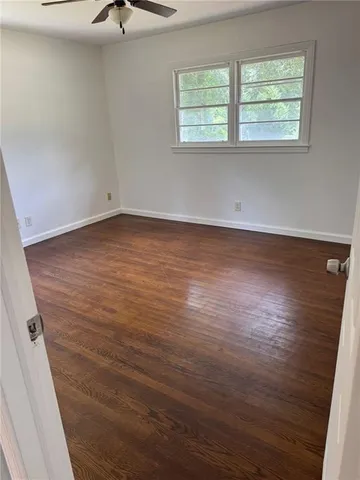 a bathroom with a sink a toilet a mirror and vanity