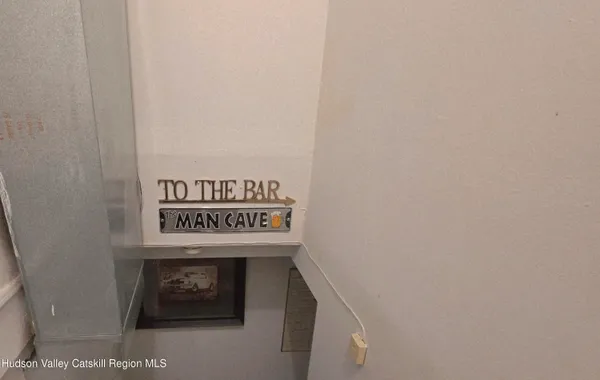 a living room with furniture and a kitchen view