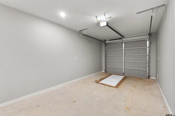 a view of room and a garage