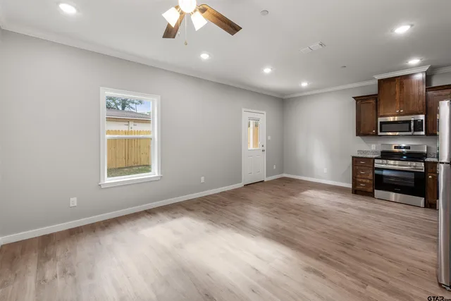 a view of kitchen with microwave and stove