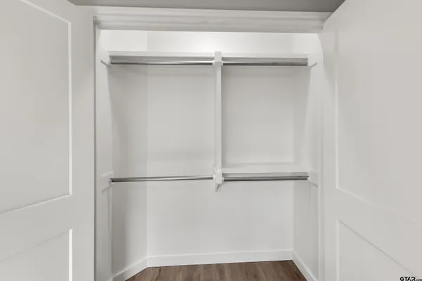 a view of an empty walk in closet