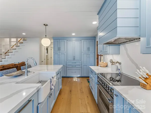 a kitchen with a table and chairs in it