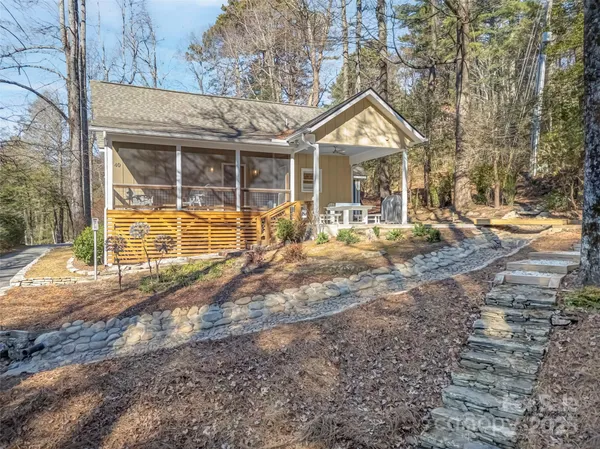 a view of house with backyard
