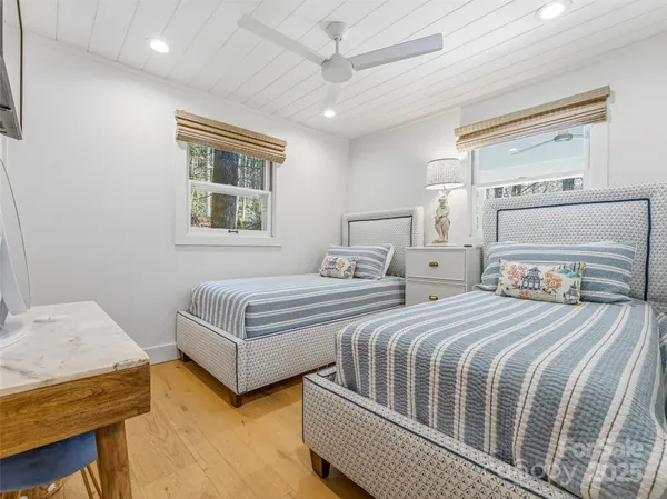 a bedroom with double bed and a window