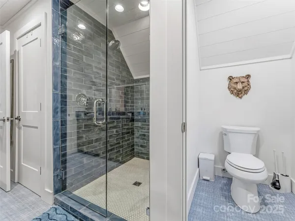 a spacious bedroom with a large bed and a couch