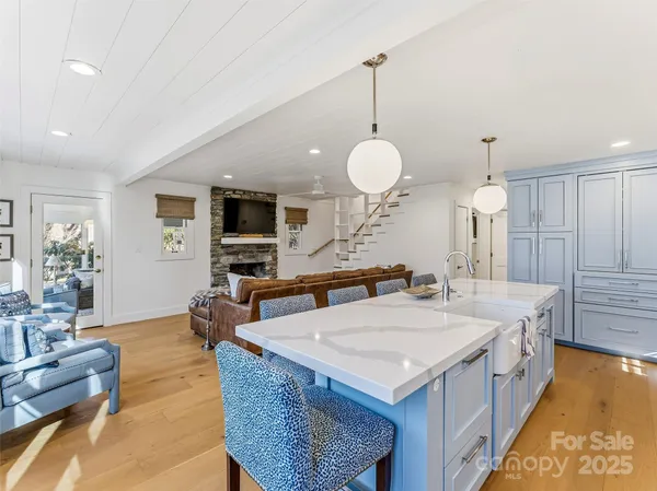a kitchen with sink stove and cabinets